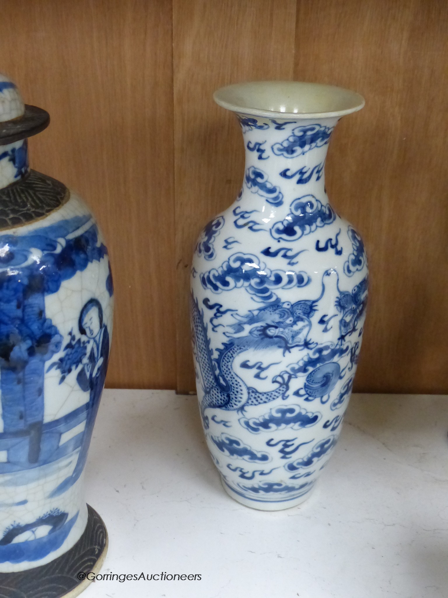 A collection of Chinese vases pottery figures and a compressed tea block, tallest piece 35cm